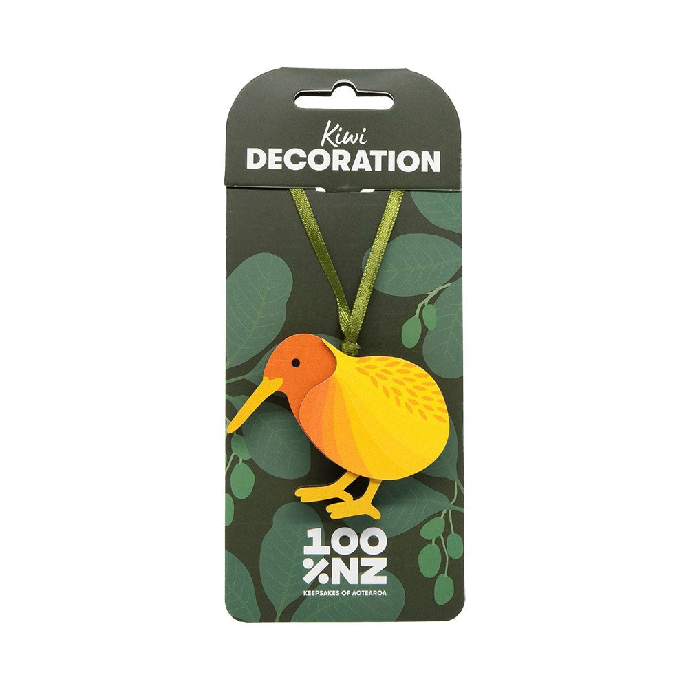 The Kiwi Wooden Decoration features a handmade wooden kiwi bird with a green ribbon, packaged in leaf-patterned wrap with 100% NZ branding—an ideal, charming addition to your Christmas tree.