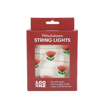 A red box labeled Pohutukawa LED Lights displays battery-powered string lights shaped like red pōhutukawa flowers. Designed in New Zealand, the set has 20 LEDs, a total length of 2.2m, and needs 2 AA batteries.