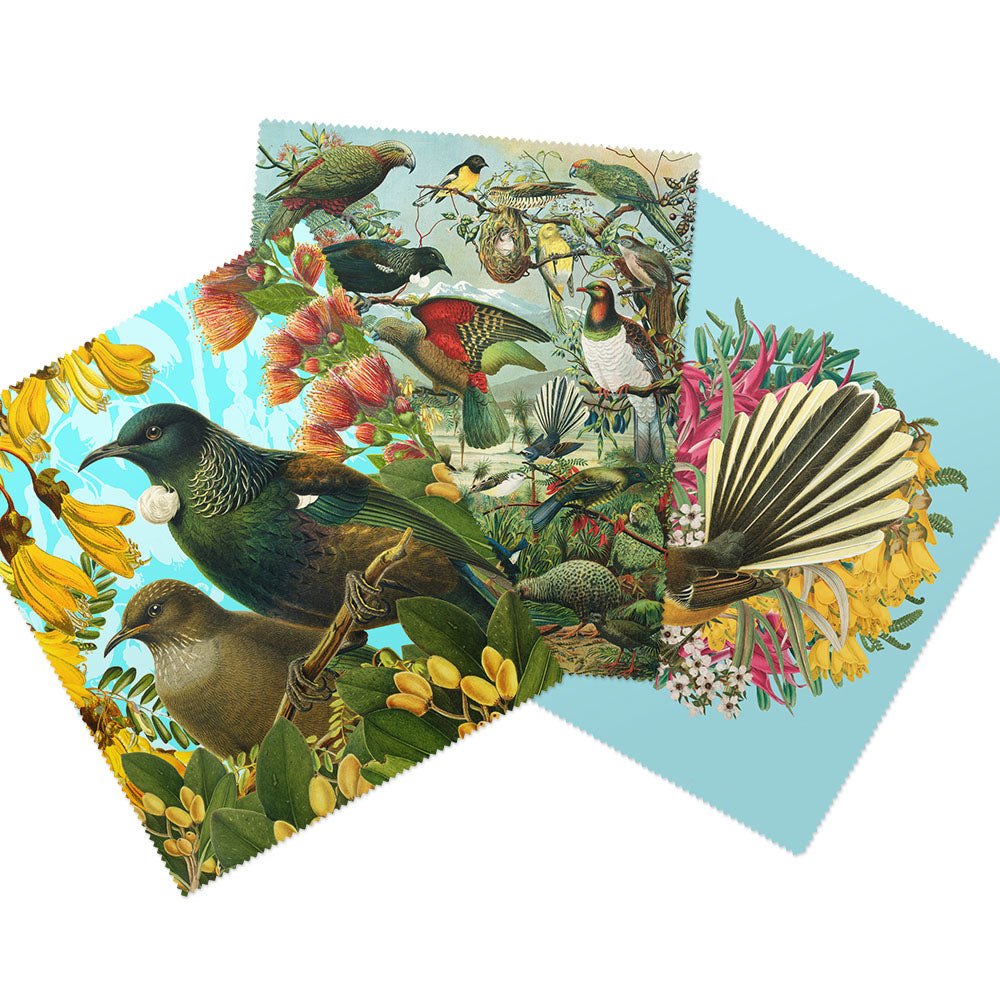 The Set of 3 Botanical Collection Lens Cloths features square cloths with vibrant New Zealand native bird illustrations amid colorful flowers and foliage on a crisp white background. Perfect for keeping your lenses clean in style.