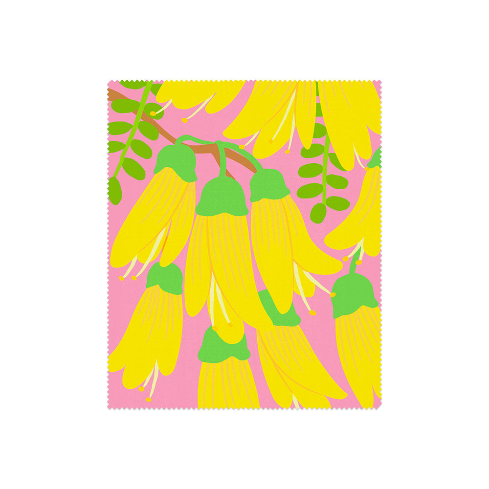 Part of the Set of 4 Bright Botanical Collection Lens Cloths, this square cloth features yellow, bell-shaped flowers with green stems and scalloped edges on a pink background, inspired by New Zealand’s flora.