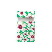 The Bright Botanical Manuka Pocket Mirror features bold Vintage Bright Botanicals—large white flowers with purple and yellow centers—for a stylish, nature-inspired accessory.