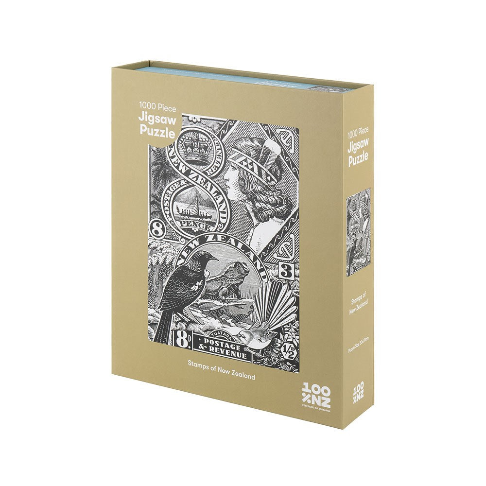 The Stamps of New Zealand Jigsaw Puzzle Box is a 1000-piece puzzle, packaged in a box featuring vintage black and white illustrations of New Zealand stamps and the text 1000 Piece Jigsaw Puzzle and Stamps of New Zealand.