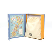 An open 1950s Fun Map Jigsaw Puzzle box shows a colorful illustrated Great Britain map on the left, and a cream drawstring bag with a black logo on the right, all set against a white background evoking vintage puzzle displays.