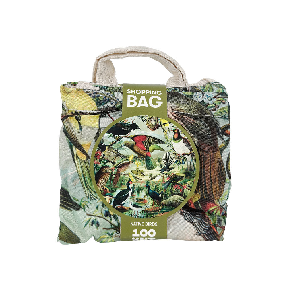 The NZ Native Birds Shopping Bag is a lightweight, foldable reusable bag with a vibrant native birds design and a cardboard label that reads Shopping Bag - Native Birds—ideal for stylish everyday shopping.