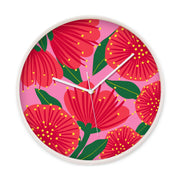 The Bright Botanical Pink Pohutukawa Wooden Frame Clock features a vibrant pink floral background inspired by New Zealand blooms, a wooden frame, silent movement, and white hands—perfect for adding charm to any space.