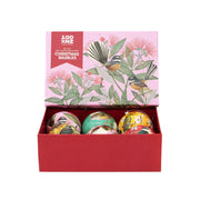 A vibrant boxset labeled “NZ Native Birds Christmas Baubles,” featuring a pink lid with bird and flower art. Contains 6 decorative baubles, each adorned with New Zealand native birds and nature-inspired designs.