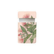 The Vintage Botanical Pohutukawa Pocket Mirror features a vegan leather rectangular case with green leaves and pink flowers. Its open top flap reveals the mirror inside—ideal for stylish, eco-friendly storage on the go.