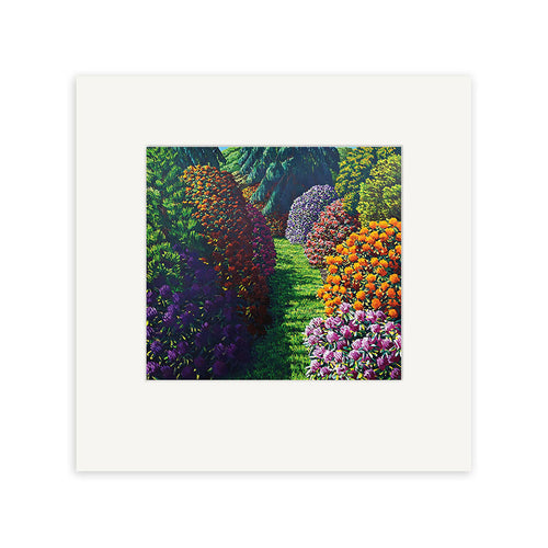 The Karl Maughan - Cross Hills Small Art Print features a vibrant garden with colorful bushes and flowers along a grassy path, bordered by trees. The elegant white mat makes it a stunning piece for any art collection, inspired by the renowned New Zealand artist.