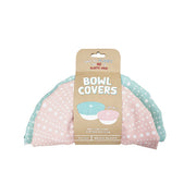 The Kina Bowl Covers (Set of 2) include one pink and one light blue cotton bowl cover with white polka dots. Both are food-safe certified, reusable, machine washable, and come with a cardboard label reading Bowl Covers. Set of 2.