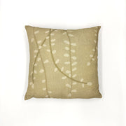 The Raw Kowhai Linen Cushion Cover is a square beige pillow cover made from natural linen, featuring a subtle pattern of white curved lines and oval shapes inspired by New Zealand native flora, photographed on a plain white background.
