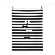 The Gordon Walters - Untitled-No.1 Tea Towel is a white rectangular cotton tea towel featuring evenly spaced horizontal black stripes and three sets of black quotation marks in the center, designed in New Zealand.