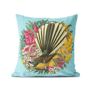 The Botanical Fantail Cushion Cover features a light blue design with a bird and vibrant flowers, inspired by unique New Zealand motifs. Made from durable polyester, it's perfect for indoor or outdoor use.