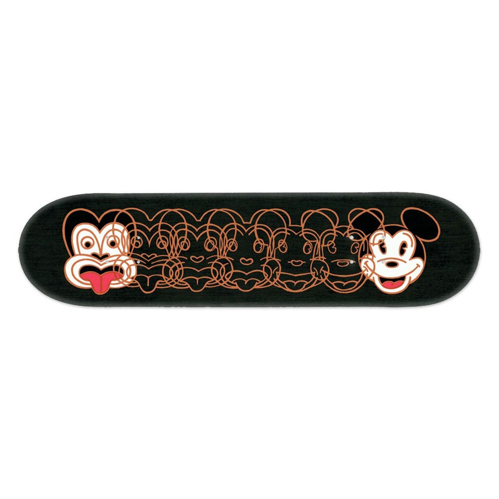 The Dick Frizzell - Mickey to Tiki (Reversed) Skateboard Deck - Second is a black Canadian maple deck with overlapping orange line art, transitioning from a Maori-style face to a cartoon mouse, inspired by vintage woodcut and New Zealand art.