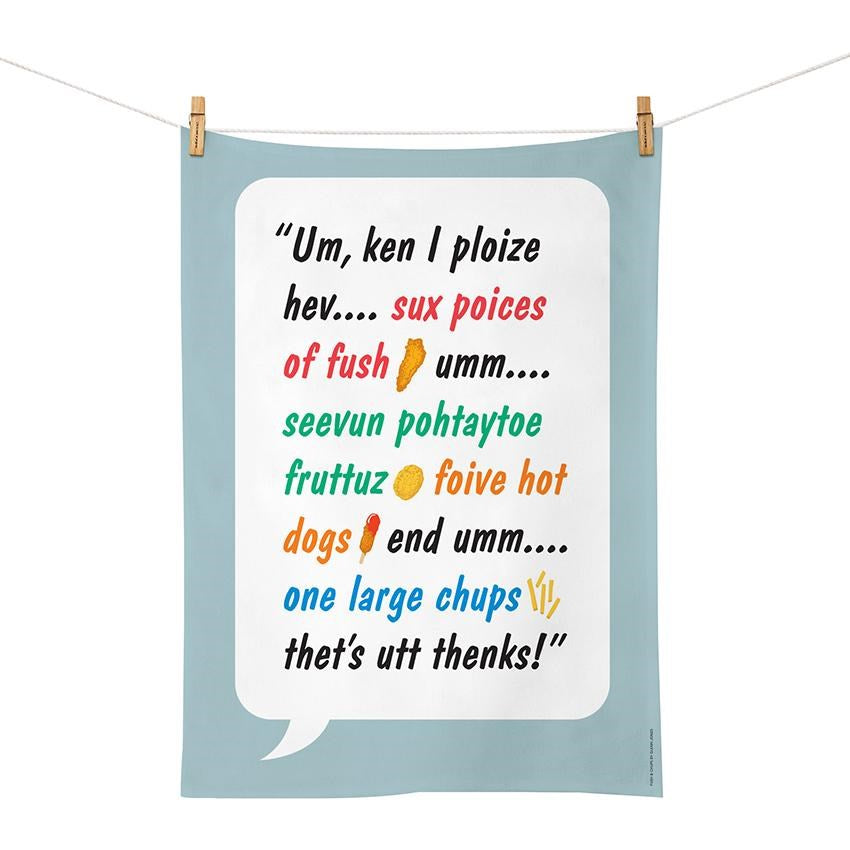 The Glenn Jones - Fush & Chups Tea Towel, designed in New Zealand, features a colorful speech bubble with a humorous, phonetically written food order, imitating a childs pronunciation.