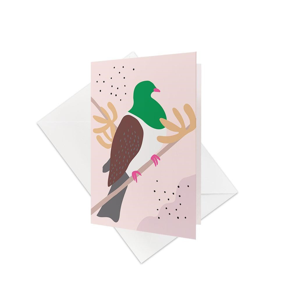The Cut-out Kereru Gift Card & Envelope (6 Pack) features a stylized New Zealand Kererū with a green head and brown wings on a branch—includes white envelopes, perfect for unique gift cards.