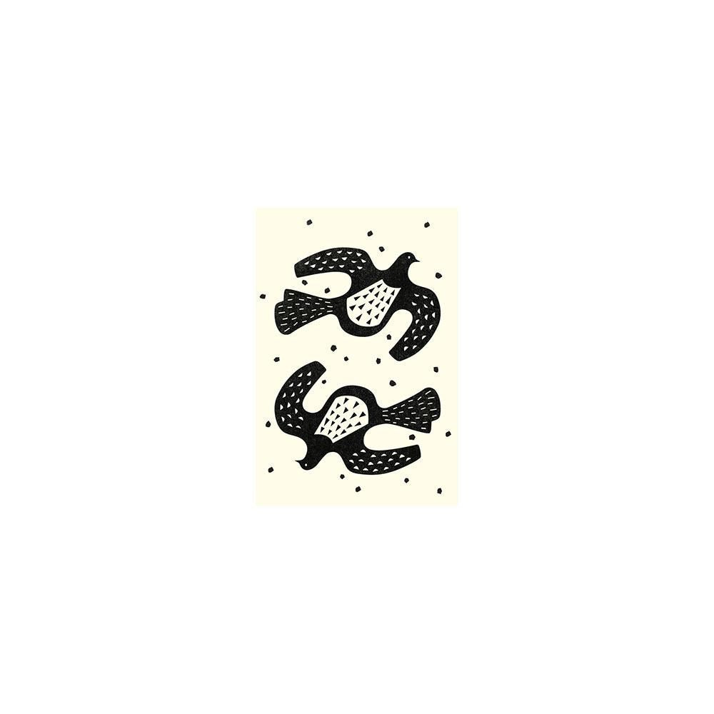 A minimal black and white linocut of two stylized kereru flying in opposite directions, surrounded by scattered dots—ideal for blank occasion cards or unique New Zealand gifts. Linocut Kereru Gift Card & Envelope (6 Pack).