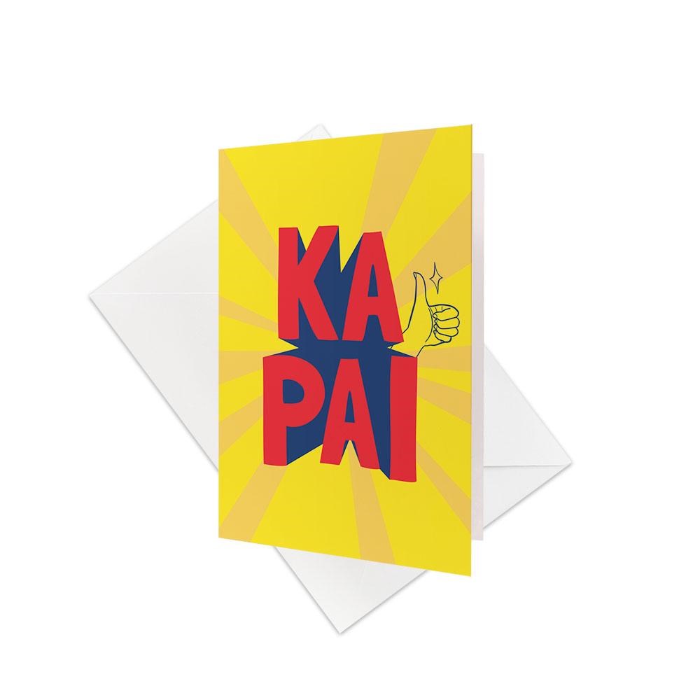 The Te Reo Ka Pai Gift Card & Envelope (6 Pack) features yellow cards with KA PAI in bold red and blue, a thumbs-up hand illustration, Te Reo Maori text, and comes with white envelopes.