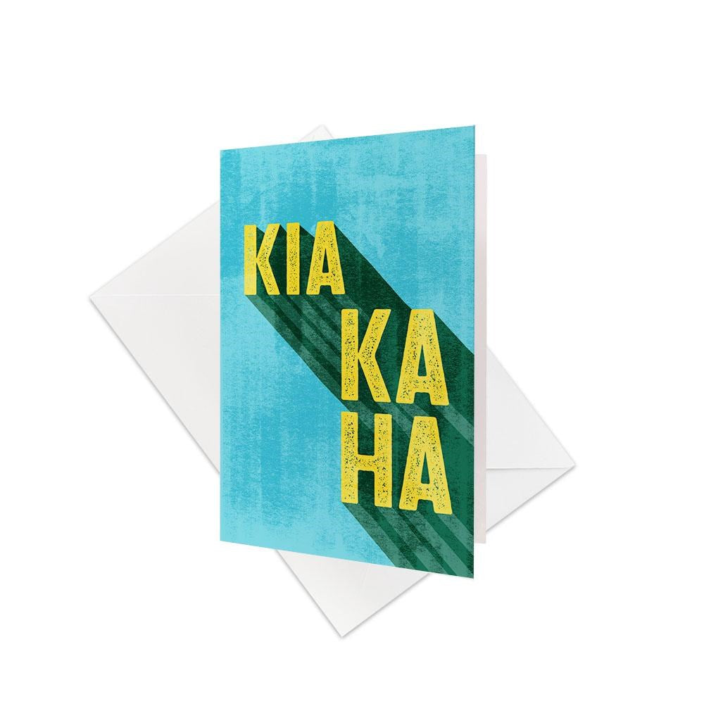 The Te Reo Kia Kaha Gift Card & Envelope (6 Pack) features cards with blue backgrounds and bold yellow KIA KAHA text, accented by a green shadow—a strong tribute to New Zealand Te Reo. Each pack includes matching white envelopes.