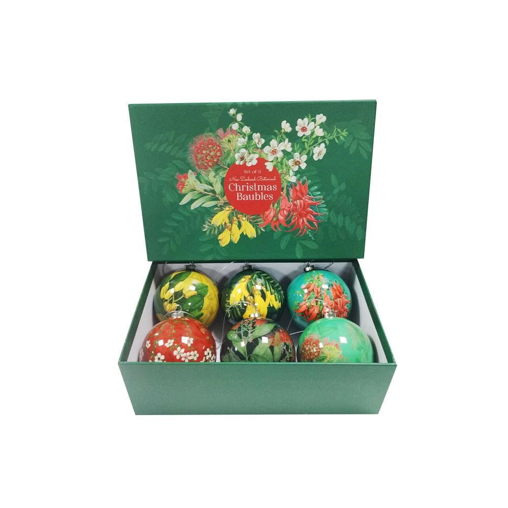 The Box of Six Flora Christmas Baubles features a green floral-designed box containing six colorful baubles, each decorated with patterns inspired by New Zealand Native Flora and beautifully displayed when the box is open.