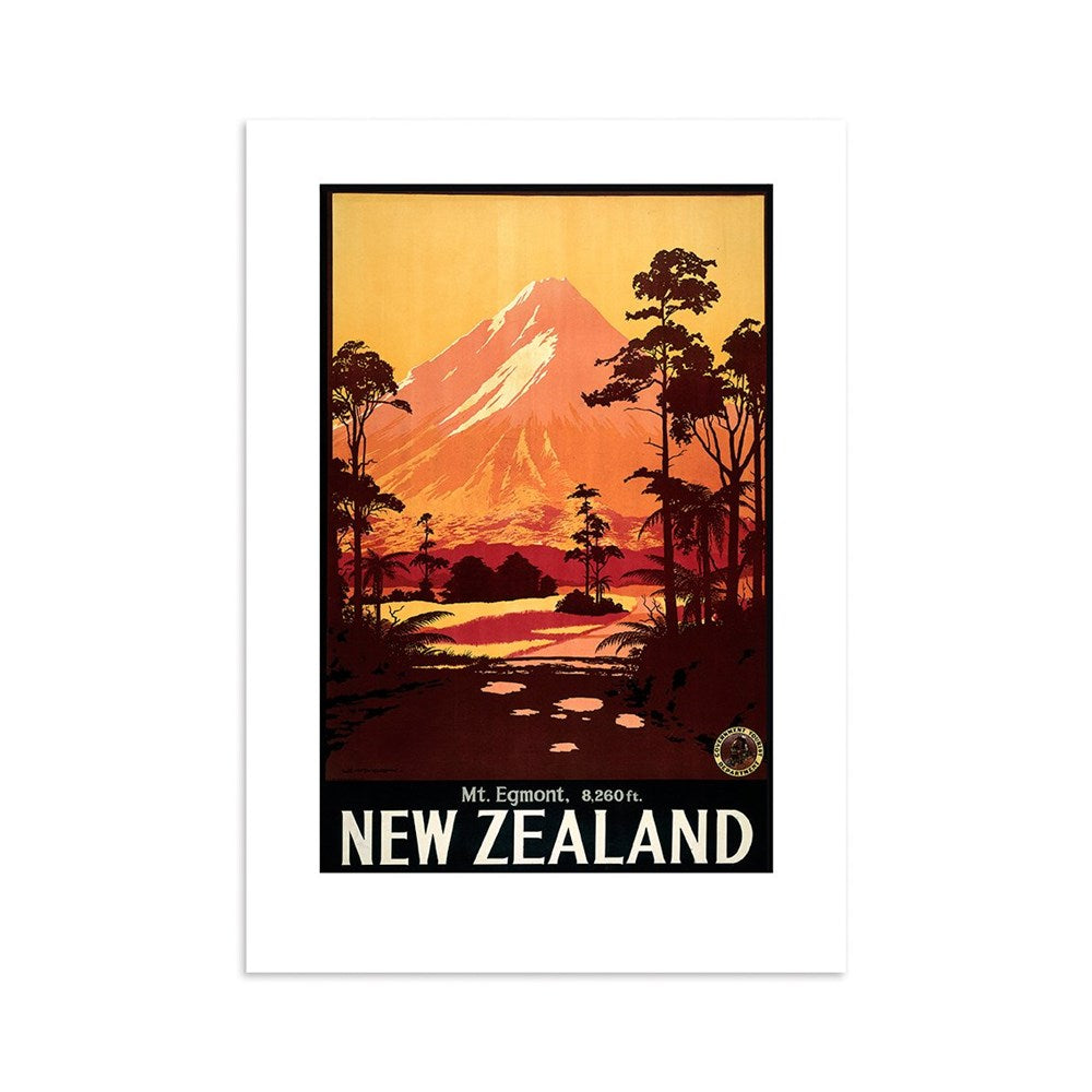 The Mt Egmont Tourist Print is a vintage-style collectible poster depicting Mt. Egmont (8,260 ft) at sunset in New Zealand, with trees and a path in the foreground. Warm orange and red hues light the sky, with NEW ZEALAND at the bottom.