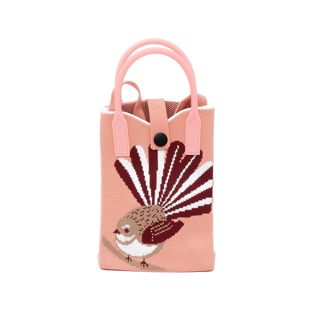 The Fantail Cross-body Bag is a small, pink fabric tote with two handles and a black button closure. It features native bird artwork in brown, white, and maroon on the front—lightweight and ideal for carrying daily essentials.