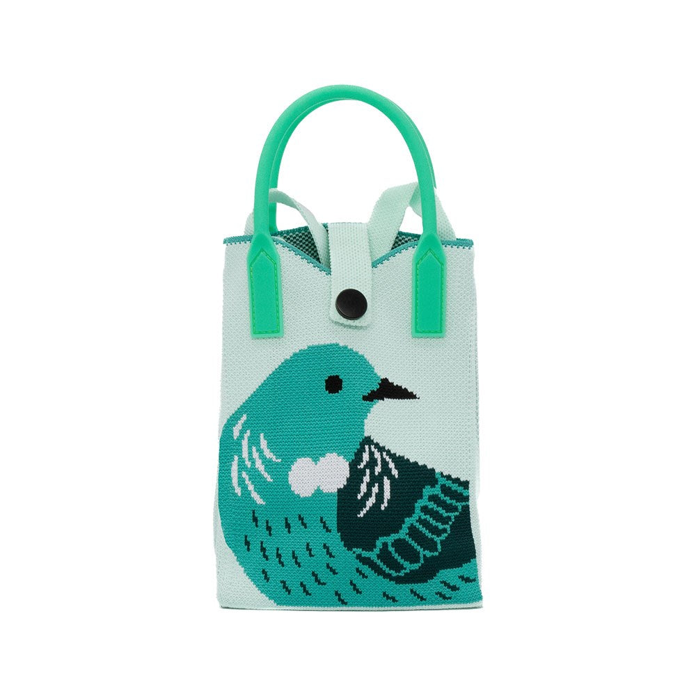 The Tui Cross-body Bag is a small, lightweight mint green tote with short green handles and a button closure. It features bold blue and black native bird artwork on the front.