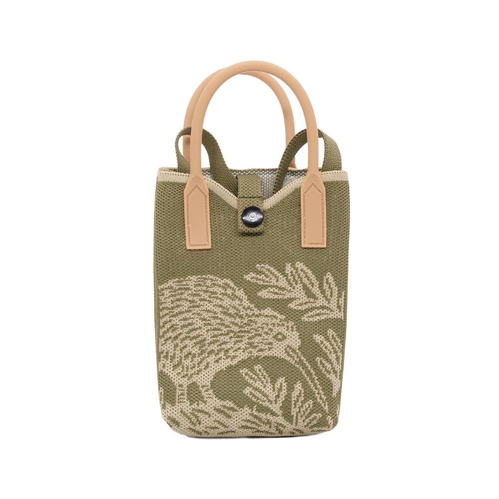 The Kiwi Woodcut Cross-body Bag is a compact olive green travel tote with tan handles, button closure, and beige embroidered native bird and plant designs—a charming kiwi motif decorates the front.