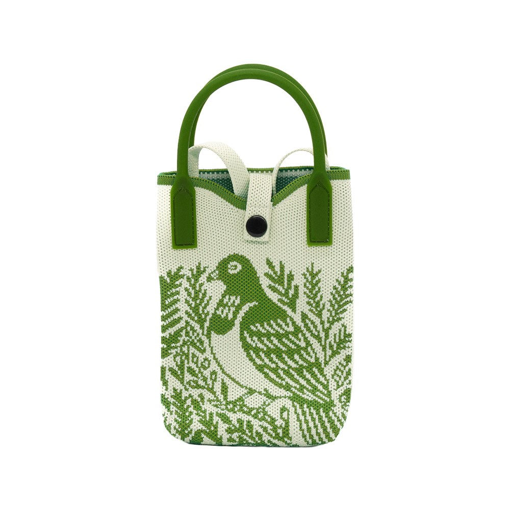 The Kereru Woodcut Cross-body Bag is a small white tote with green handles and trim, featuring native bird and foliage artwork. Made of textured fabric, it’s lightweight with a button closure for added style.
