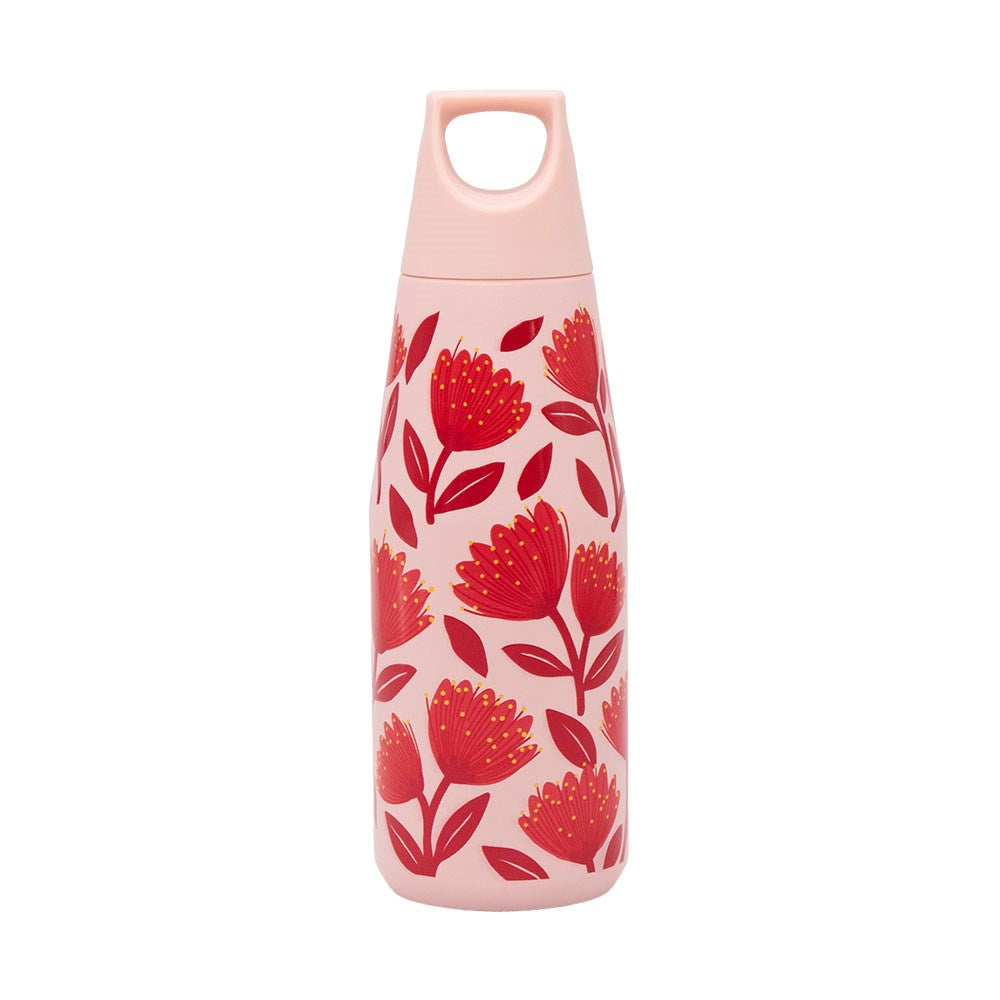 The Pohutukawa Glade Drink Bottle is a light pink, vacuum insulated bottle with a handled cap, adorned with red flowers and green leaves. Its leak-resistant lid keeps your drinks secure and fresh all day long.
