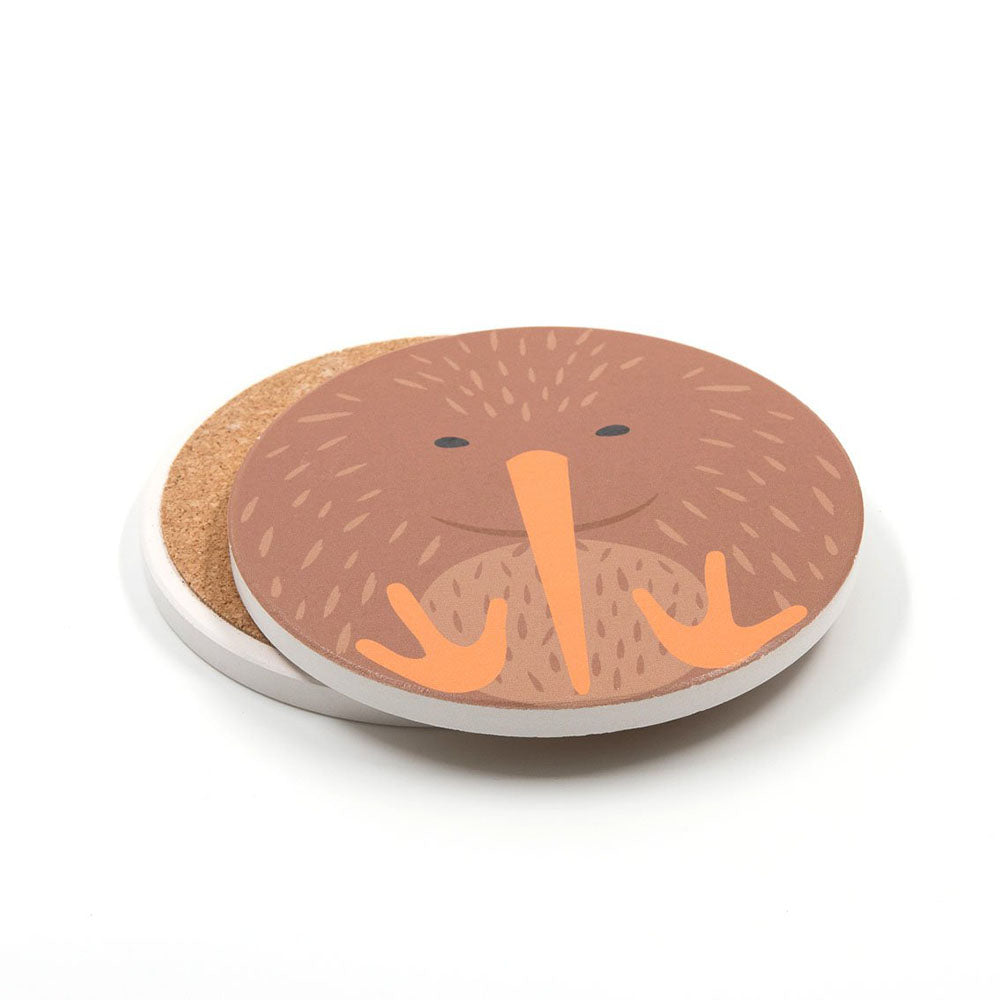 This Set of 4 Cuties Ceramic Coasters features round, cork-bottom coasters with a cartoon brown kiwi bird—orange beak and feet—on a white background, ideal for New Zealand bird fans or unique bird-themed gifts.