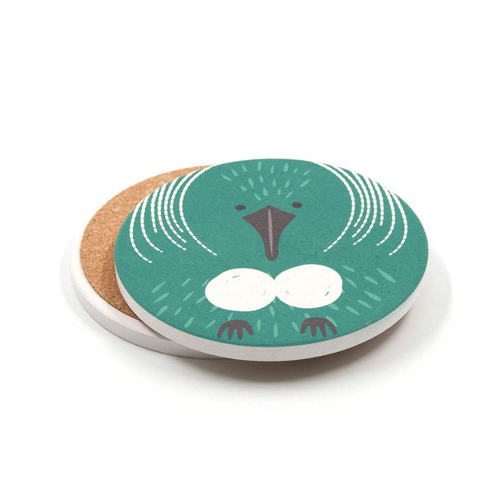 The Set of 4 Cuties Ceramic Coasters features a round Kiwi design with a green New Zealand bird, dark beak, white markings, and eggs. With cork backing and white edge, these are perfect gifts for bird lovers or fans of New Zealand wildlife.