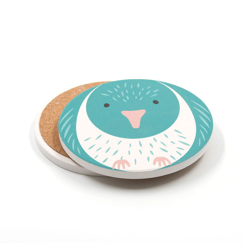 Set of 4 Cuties Ceramic Coasters featuring a teal and white cartoon bird, inspired by New Zealand birds. With cork backing for grip, these round coasters are perfect for bird-themed gifts. Displayed on a plain white background.