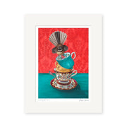 The Angie Dennis - Cracking Up Art Print features a stack of ornate teacups, a teal cup topped with a bird, set against red wallpaper and a green table. Printed on archival matte paper, its ideal for NZ art lovers.