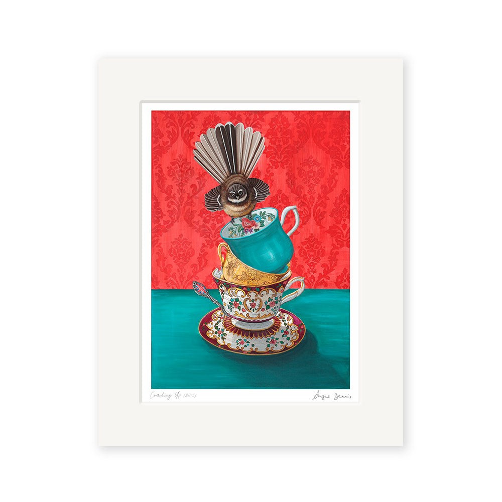 The Angie Dennis - Cracking Up Art Print features a stack of ornate teacups, a teal cup topped with a bird, set against red wallpaper and a green table. Printed on archival matte paper, its ideal for NZ art lovers.
