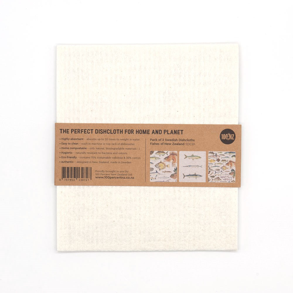 The Swedish Dishcloths - Fishes of NZ is a white dishcloth wrapped with a brown paper band, decorated with fish designs and text. This eco-friendly, reusable cloth is a great addition to your Swedish dishcloth collection.