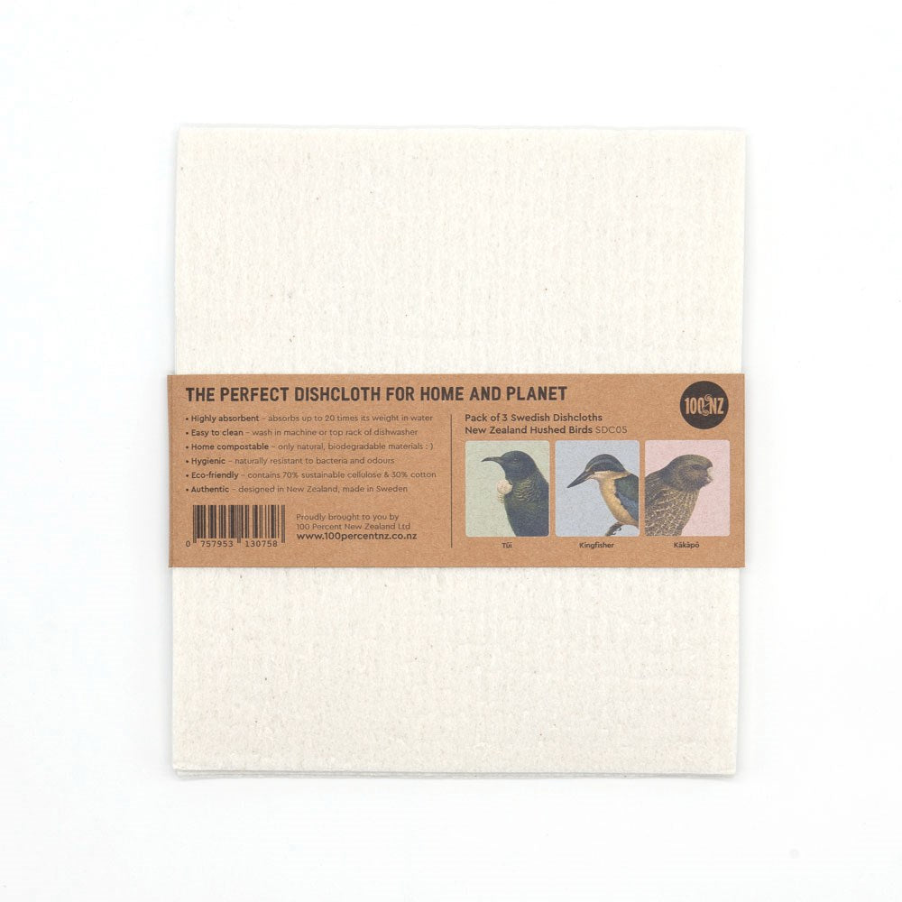 A pack of 3 eco-friendly white Swedish Dishcloths - Hushed Birds comes with a brown paper label featuring bird illustrations, product info, barcode, website, and the slogan: The Perfect Dishcloth For Home and Planet.