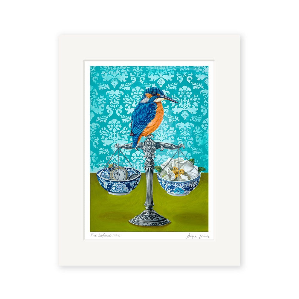 Angie Dennis - Fine Balance Art Print features a vibrant kingfisher on a balance scale with porcelain bowls holding silver fish and a gold insect, all set against a patterned turquoise background—ideal for NZ art lovers.