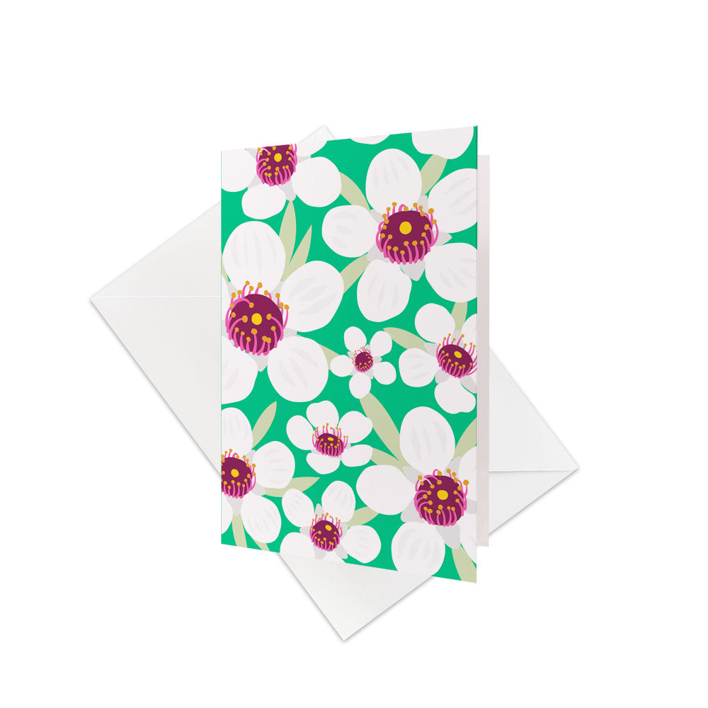 The Bright Botanical Manuka Gift Card & Envelope (6 Pack) features a vibrant floral pattern with large Manuka flowers on green—perfect for gifting and inspired by New Zealand’s beauty. Includes six cards and plain white envelopes.