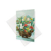 The NZ Native Flowers Gift Card & Envelope (6 Pack) features colorful native flora in a carved wooden container, with “Native Flowers of New Zealand” at the top. Includes white envelopes. Blank inside—ideal for gift cards or personal messages.