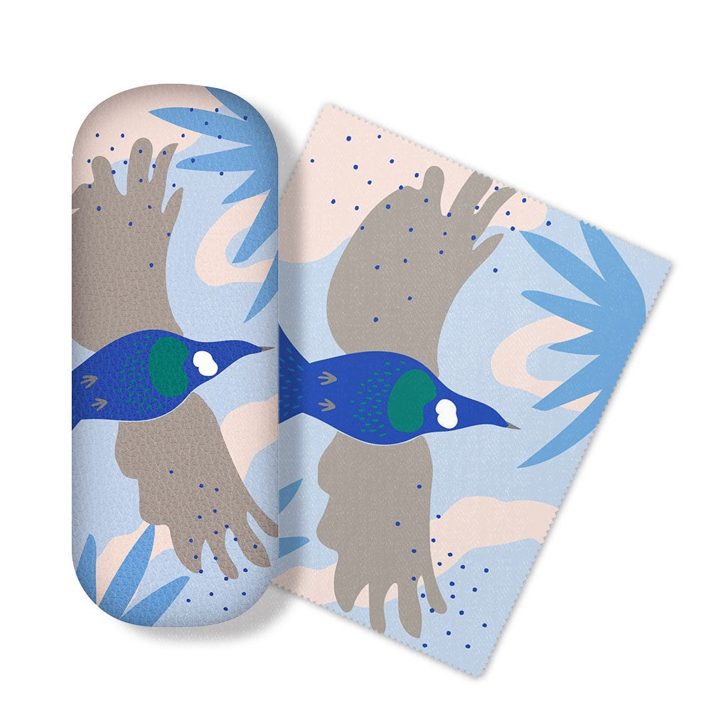 The Cut-out Tui Glasses Case includes a case and matching cleaning cloth with a blue, green, and gray tui bird design on a pastel abstract background with leaf shapes. Perfect for cleaning glasses lenses or electronics screens.