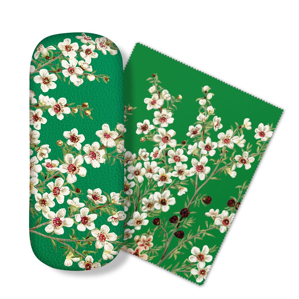The Manuka Flower Glasses Case includes a green case and matching micro-fibre cloth featuring white and pink cherry blossoms with green leaves, perfect for cleaning glasses or screens. Both have a plain white background.
