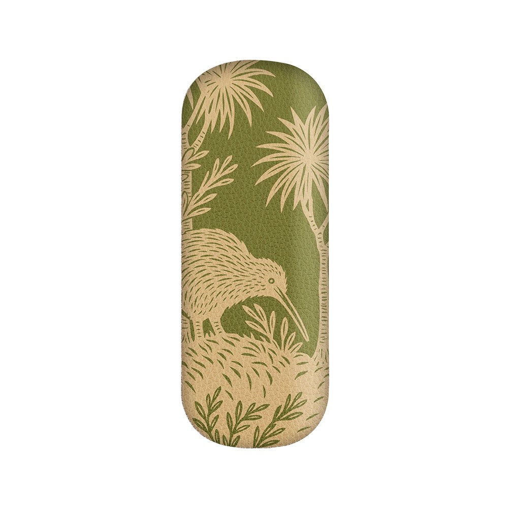 Introducing the Woodcut Kiwi Glasses Case—a green, rectangular vegan leather case with rounded edges and hard shell protection. It showcases a beige woodcut-style illustration of a kiwi bird next to a cabbage tree amid lush foliage.