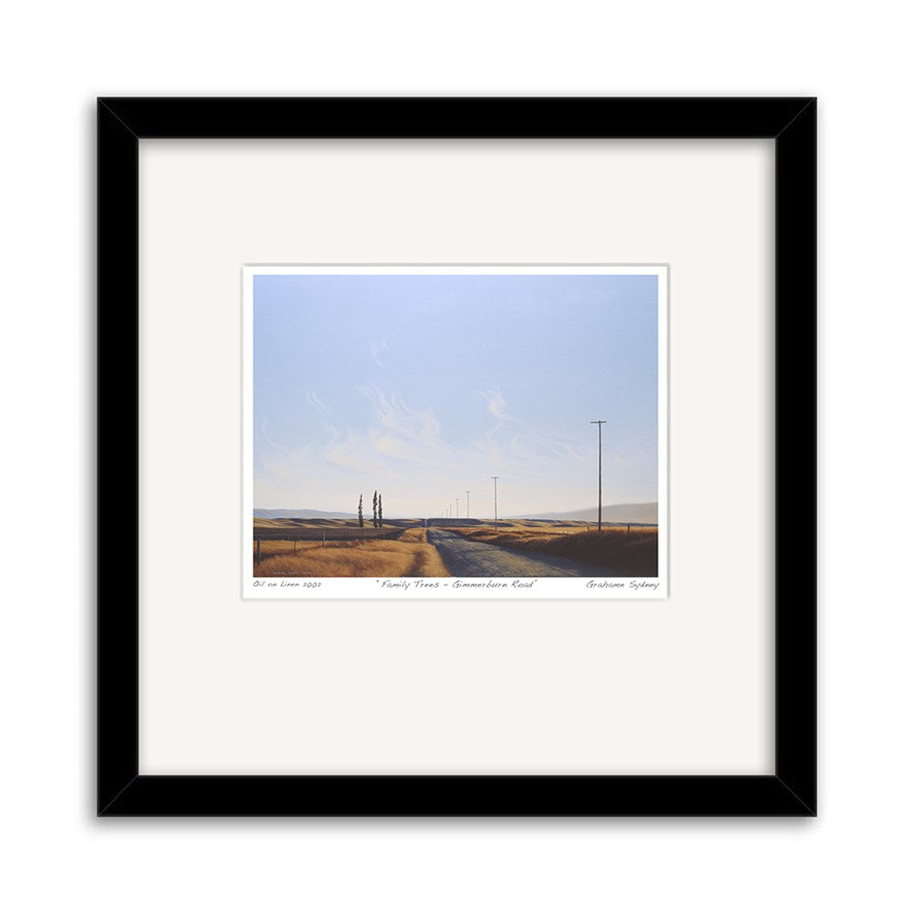 The Grahame Sydney - Family Trees, Gimmerburn Road Small Art Print captures a rural New Zealand scene with a dirt road, telephone poles, and sparse trees under a pale blue sky, framed in black with a white mat for added elegance.