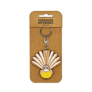 The Fantail Wooden Keyring features a fantail bird with spread tail feathers, attached to brown card packaging labeled HANDMADE KEYRING Fantail—a charming, handmade Kiwi-themed keychain and unique accessory.