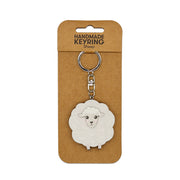 The Sheep Wooden Keyring features a cartoon-style sheep charm on a sturdy metal ring and chain, presented on brown card labeled HANDMADE KEYRING Sheep—a charming handmade Aotearoa keepsake.