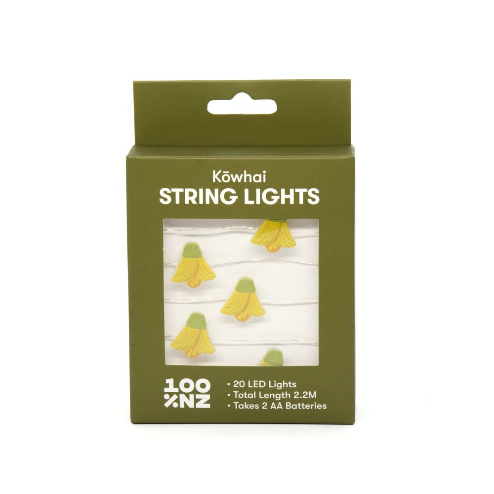 Green box labeled "Kowhai LED Lights" displays yellow, NZ flower-shaped LEDs. Contains 20 battery-powered LEDs, 2.2m long, needs 2 AA batteries. Brand marked “100% NZ.”.