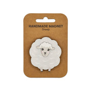 The Sheep Wooden Magnet features a handmade, cartoon-style sheep with a white fluffy body on a brown card labeled HANDMADE MAGNET Sheep. Perfect for decorating any magnetic surface.