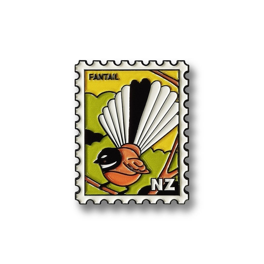 The Fantail Collectible Stamp Magnet features Glenn Jones Artwork of a stylized fantail bird on a green and yellow background with FANTAIL and NZ displayed, designed to resemble a postage stamp.