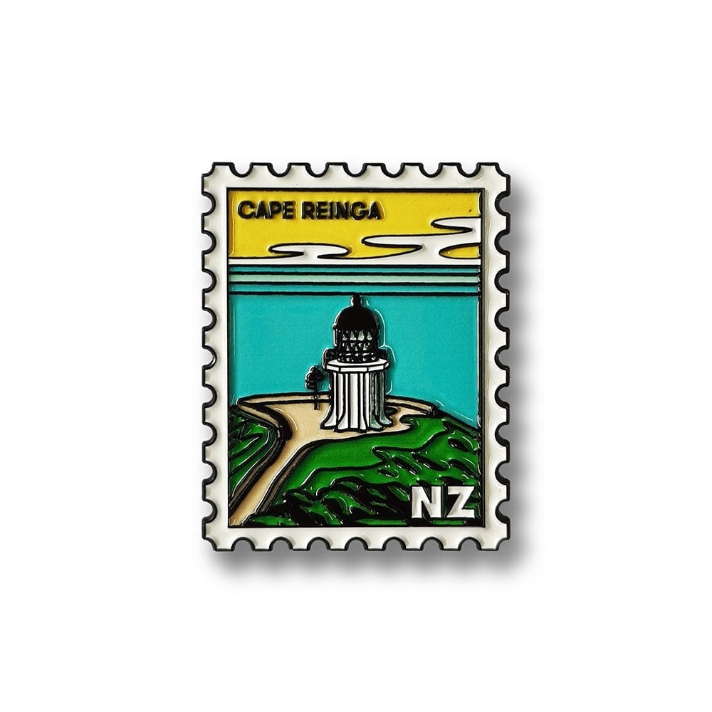 The Cape Reinga Collectible Stamp Magnet features a Glenn Jones illustration of the Cape Reinga lighthouse in New Zealand, with a yellow sky, green landscape, and CAPE REINGA and NZ text at the bottom.