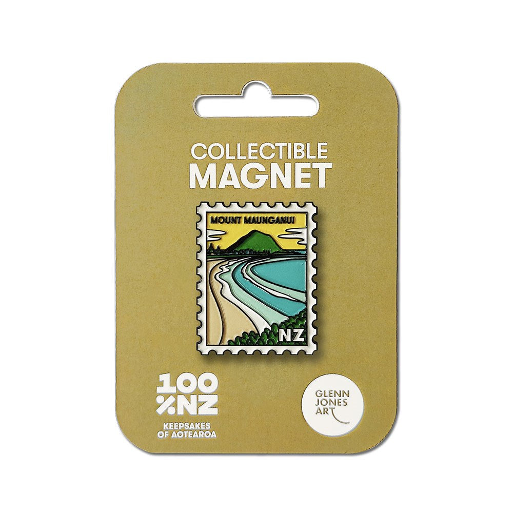 The Mt Maunganui Collectible Stamp Magnet features an illustrated mountain, beach, and ocean design. It comes on a tan backing card labeled 100% NZ and Glenn Jones Art.